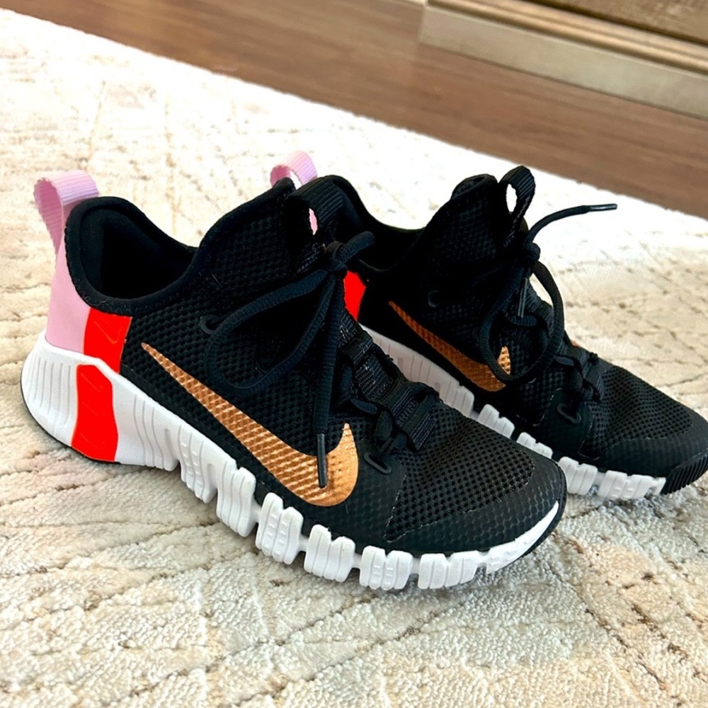 Nike Black and Gold Athletic Shoes with Red and Pink Details